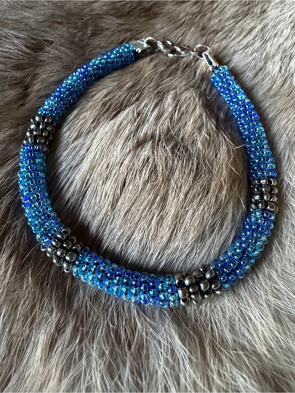 Iridescent Blue Beaded Bracelet with Metallic Accents -